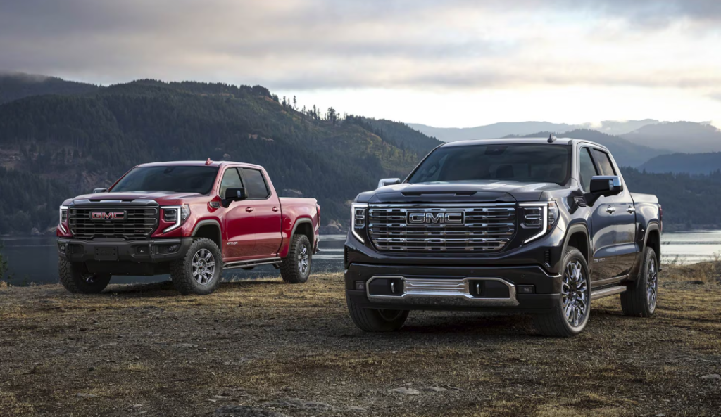 Two 2026 GMC Sierra 1500s parked by lake