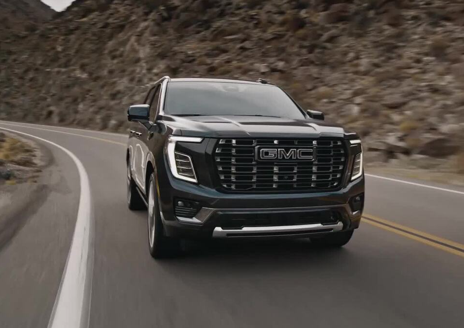 Black 2026 GMC Yukon driving on road