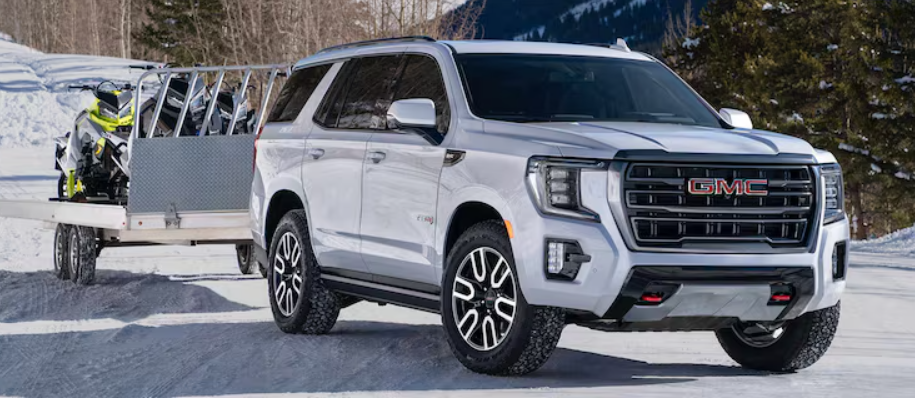 White 2026 GMC Yukon towing trailer
