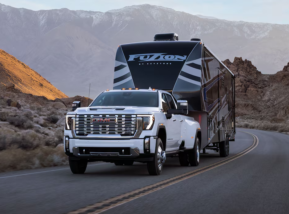 White GMC sierra 3500 towing a trailer