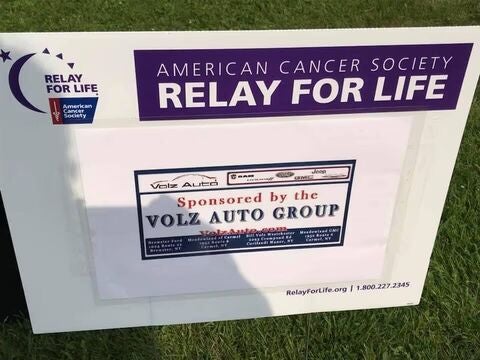 Relay For Life sponsor sign on grass.
