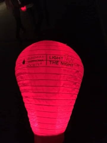 Red Light The Night lantern glowing in the dark.